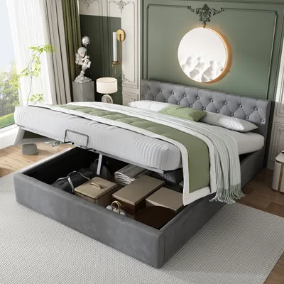 A bed with its storage compartment open, revealing items stored inside.