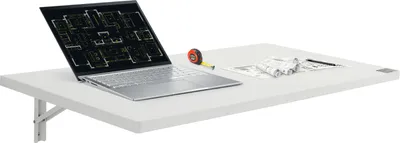 A white wall-mounted folding table with a laptop displaying blueprints, a tape measure, and rolled-up papers.