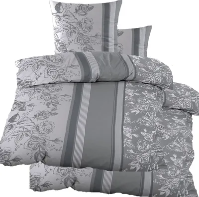 A neatly folded set of bedding with a floral and striped pattern.