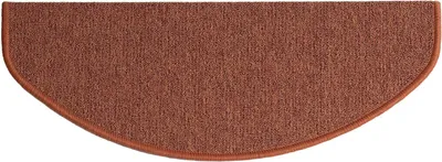 A single, brown, semi-circular carpet stair tread.