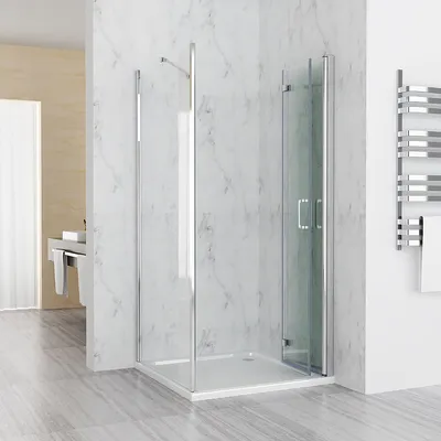 A modern bathroom with a glass shower enclosure.