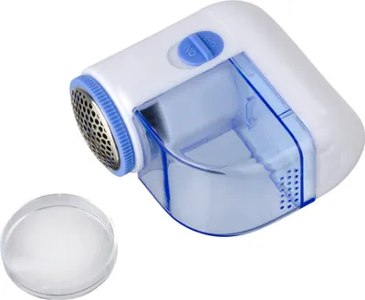 A lint remover and a small clear container with lint.