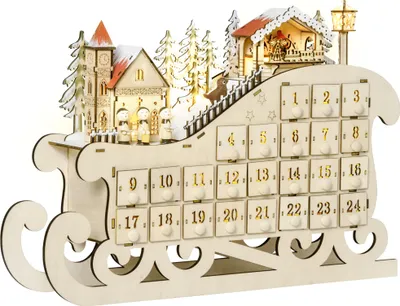 A wooden advent calendar in the shape of a sleigh, decorated with a winter village scene and LED lights.