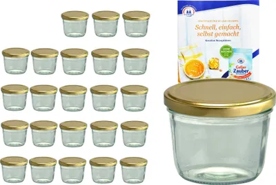 A set of small glass jars with gold lids, along with a product box and a single jar in the foreground.