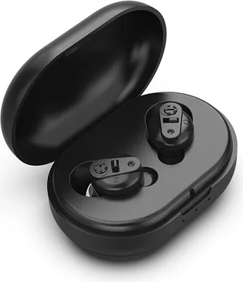 A pair of black hearing aids are placed inside their open black charging case.