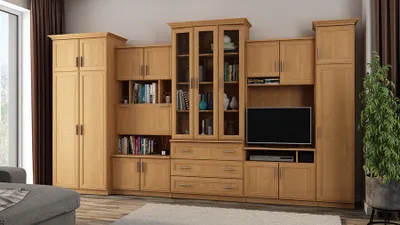 A large wooden entertainment center with multiple cabinets, shelves, and drawers, featuring a television.