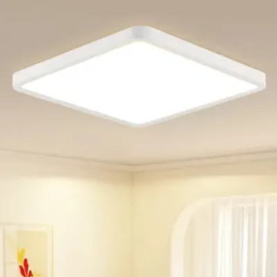 A white square LED ceiling light is mounted on a white ceiling in a room with light yellow walls and a white curtain visible in the background.