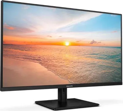A computer monitor displaying a sunset beach scene.