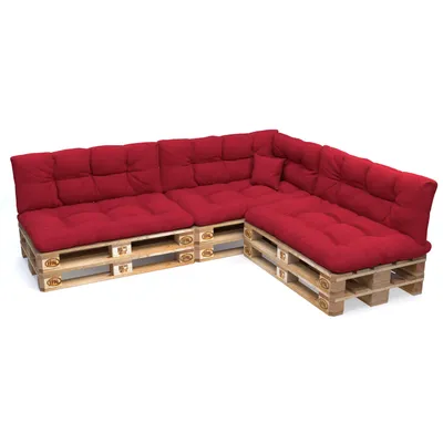A sectional sofa made from wooden pallets with red cushions, shown against a white background.