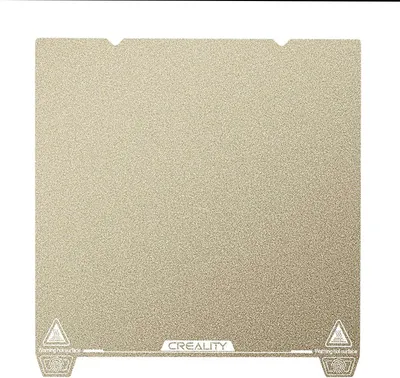 A flat, square build plate with a textured surface, likely for a 3D printer.