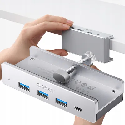 Zdjęcie produktu dla Orico Mh4Pc Hub z mocowaniem zaciskowym Usb-C / 3X Usb-A 3.0 + 1X Usb-C 3.0 - srebrny