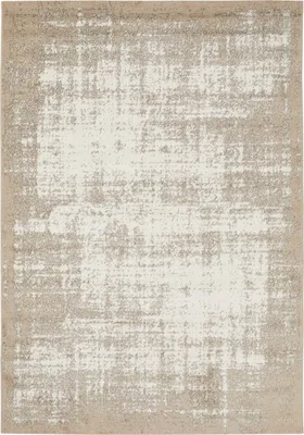 A top-down view of a rug with a distressed, abstract pattern.