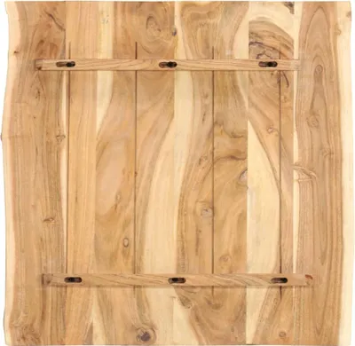 The back of a wooden table top with support beams.