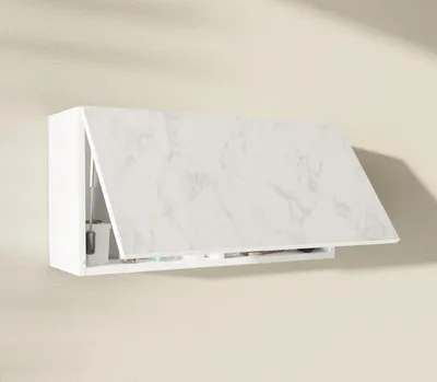 A white wall-mounted cabinet with a marble-patterned door is shown slightly ajar.