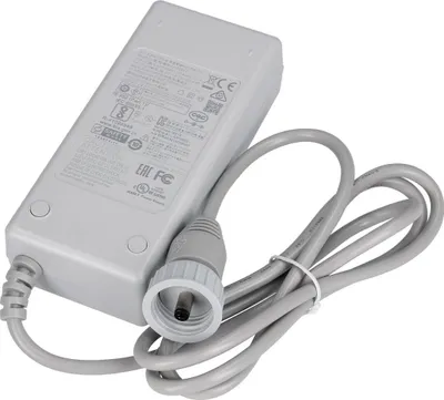 A gray power adapter with a coiled cable and a connector.
