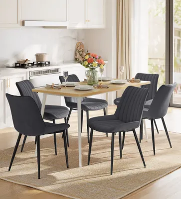 A dining set with chairs and a table in a kitchen setting.