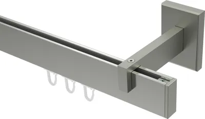A close-up view of a curtain rod system with a bracket.