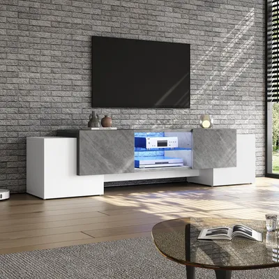 A modern living room with a TV stand and television.