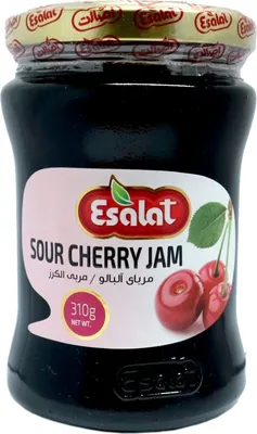 A jar of sour cherry jam on a white background.