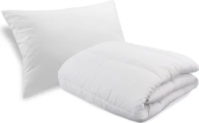 A white pillow and a folded white comforter are shown against a white background.
