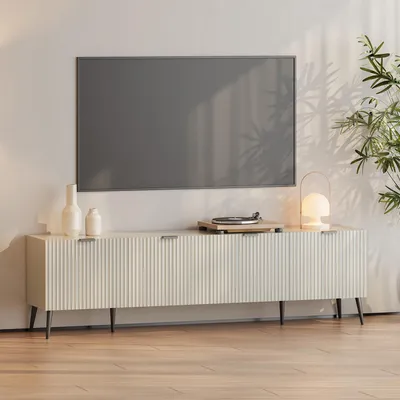A modern media console with a television mounted above it, in a well-lit room.