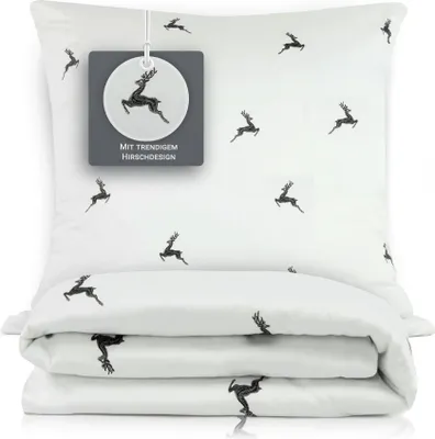 A folded duvet and pillowcase set with a deer pattern, displayed on a white background.