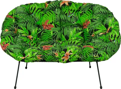 A cushion with a tropical leaf pattern on a white background.