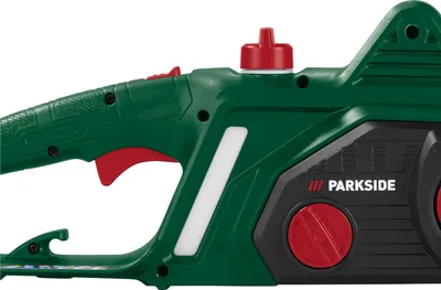 A close-up view of the handle and motor housing of an electric chainsaw.