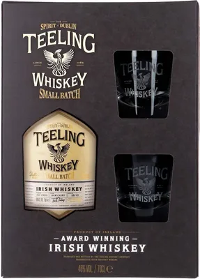 A gift set containing a bottle of Teeling Small Batch Irish Whiskey and two whiskey tumblers, presented in a dark gray box.