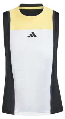 Immagine prodotto di Adidas - Canotta da donna, vestibilità regolare, senza maniche, modello GT33408 (taglia 34 DE) (bianco/nero/arancione)
