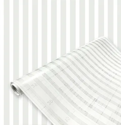 A roll of striped window film is shown in front of a wall with the same striped pattern.