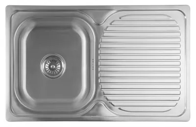 A top-down view of a stainless steel kitchen sink with a drainboard.