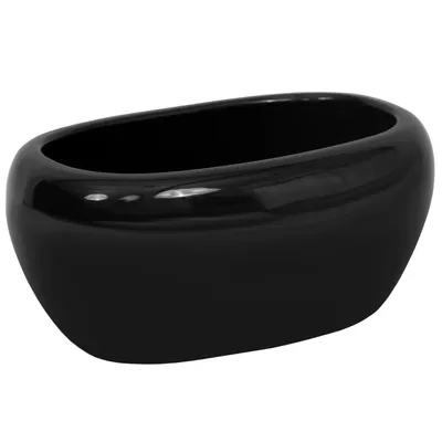 A black oval ceramic planter is shown against a white background.
