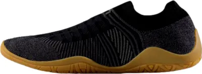 A side view of a black and gray shoe with a tan sole.
