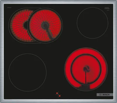 A top-down view of a black electric stovetop with four burners. Two burners on the top left are glowing red, indicating they are hot. One burner on the bottom right is also glowing red. The other two burners are black and not illuminated.