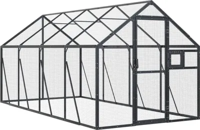 A greenhouse structure made of aluminum frame and mesh panels.