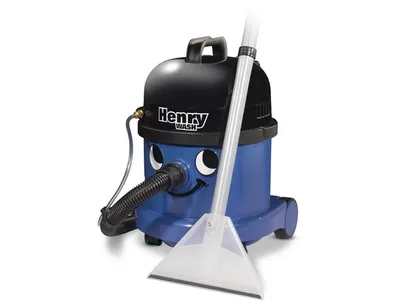 A blue and black Numatic Henry Wash carpet cleaner with a clear plastic cleaning attachment and hose, set against a white background.