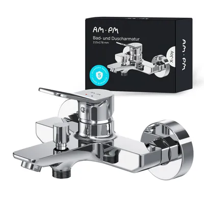 A chrome-finished bathtub faucet is shown in the foreground, with its packaging in the background.