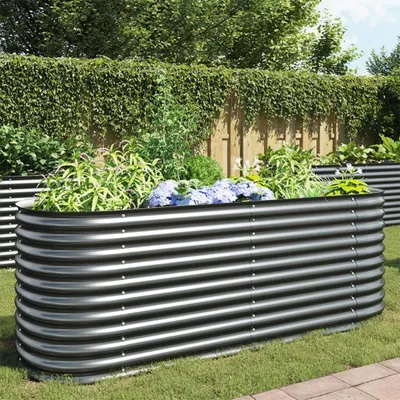 A raised garden bed filled with plants in a garden setting.
