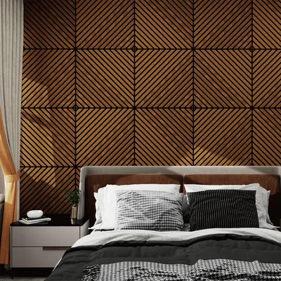 A bedroom scene with a bed and a wall covered in wood paneling.