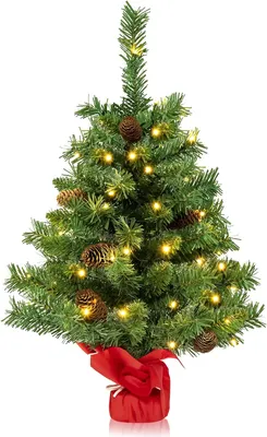 Immagine prodotto di Albero di Natale artificiale da 64 cm, mini albero di Natale con 50 LED, 8 modalità di illuminazione e 8 pigne, alimentato a batterie, piccola decorazione natalizia da tavolo, base in cemento inclusa