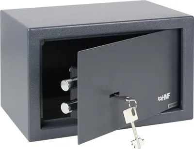 A dark gray safe with its door slightly open, revealing two silver locking bolts. A silver key is inserted into the lock on the door.