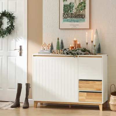 A hallway or entryway with a white door, a sideboard, and decorative items.
