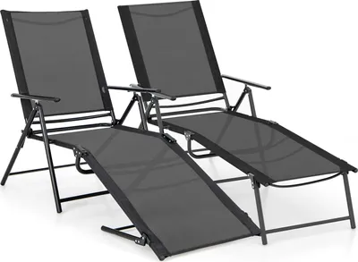 Two black folding lounge chairs are shown against a white background.