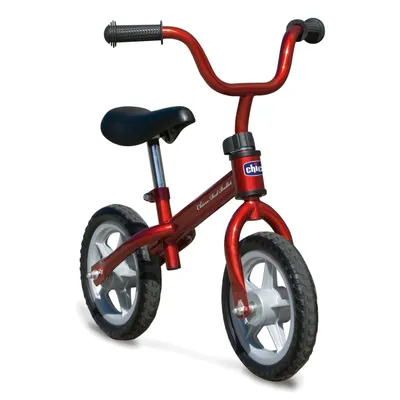 A red balance bike on a white background.