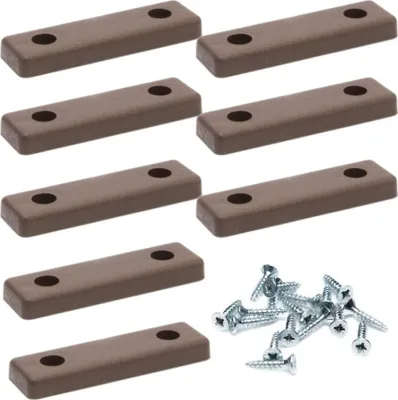 A collection of brown furniture glides and silver screws arranged on a white background.
