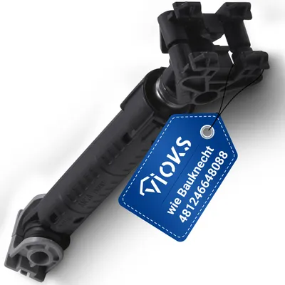 A black washing machine damper with a blue tag attached.