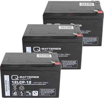 Three black batteries are stacked diagonally on a white background.