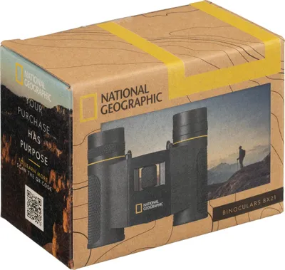 The image shows the packaging of National Geographic binoculars, with a scenic background and a person hiking.