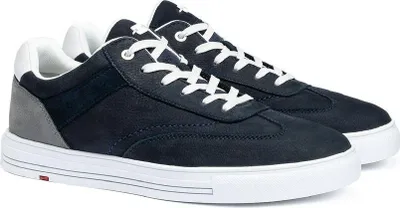 A pair of navy blue low-top sneakers with white laces and soles, set against a white background.